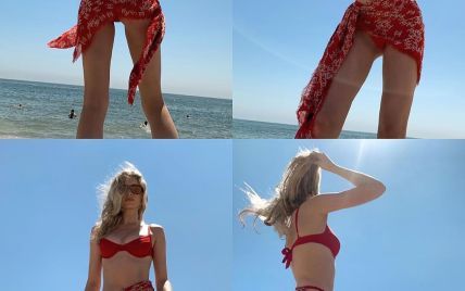 С платком на бедрах: Эльза Хоск в красном бикини загорала на пляже