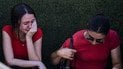 Люди ждут новостей о своих близких у порта в Кирении после того, как у побережья перевернулся паром