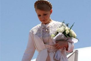Тимошенко відлетіла до Лівії у сукні в мусульманському стилі