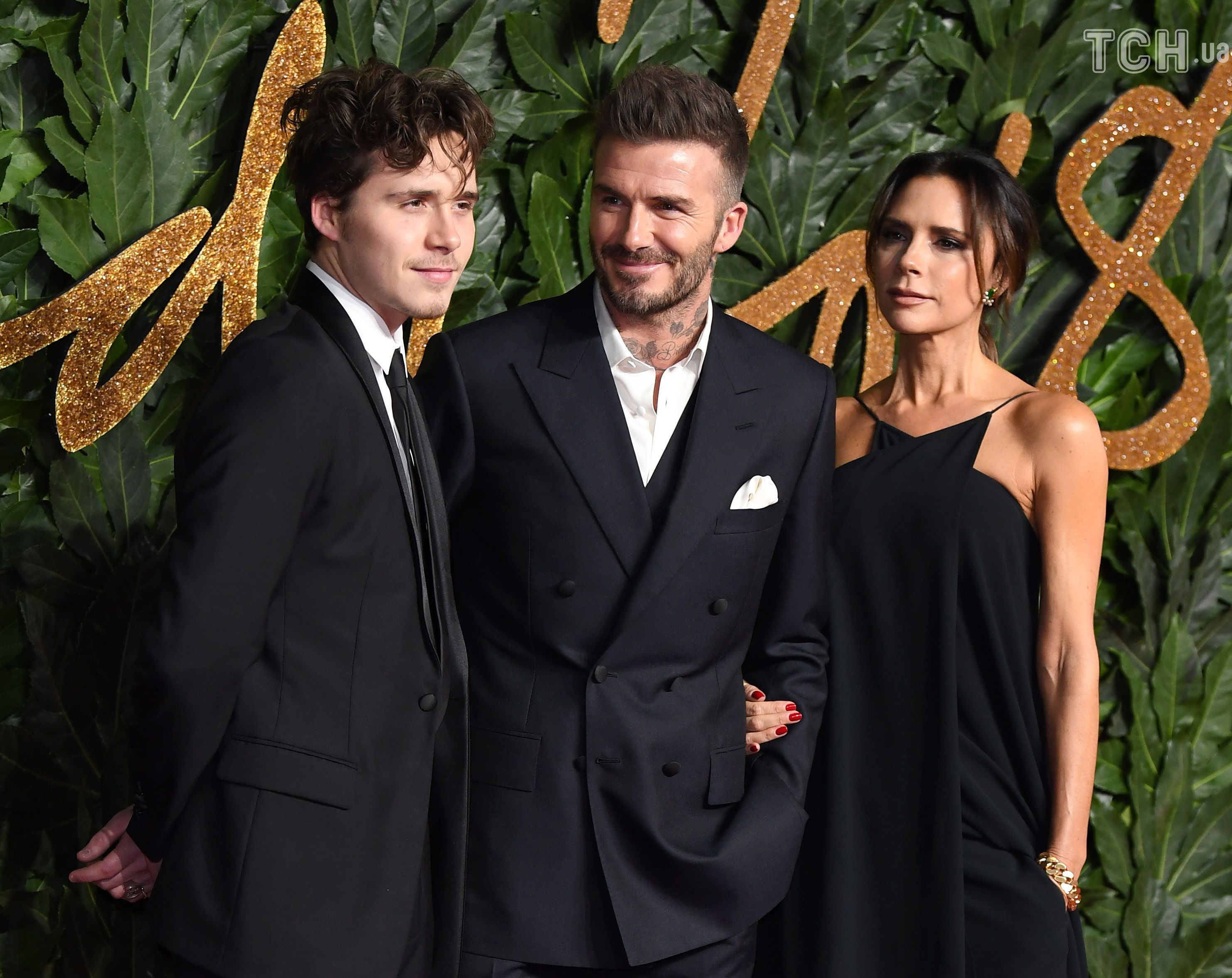   David, Brooklyn and Victoria Beckham 