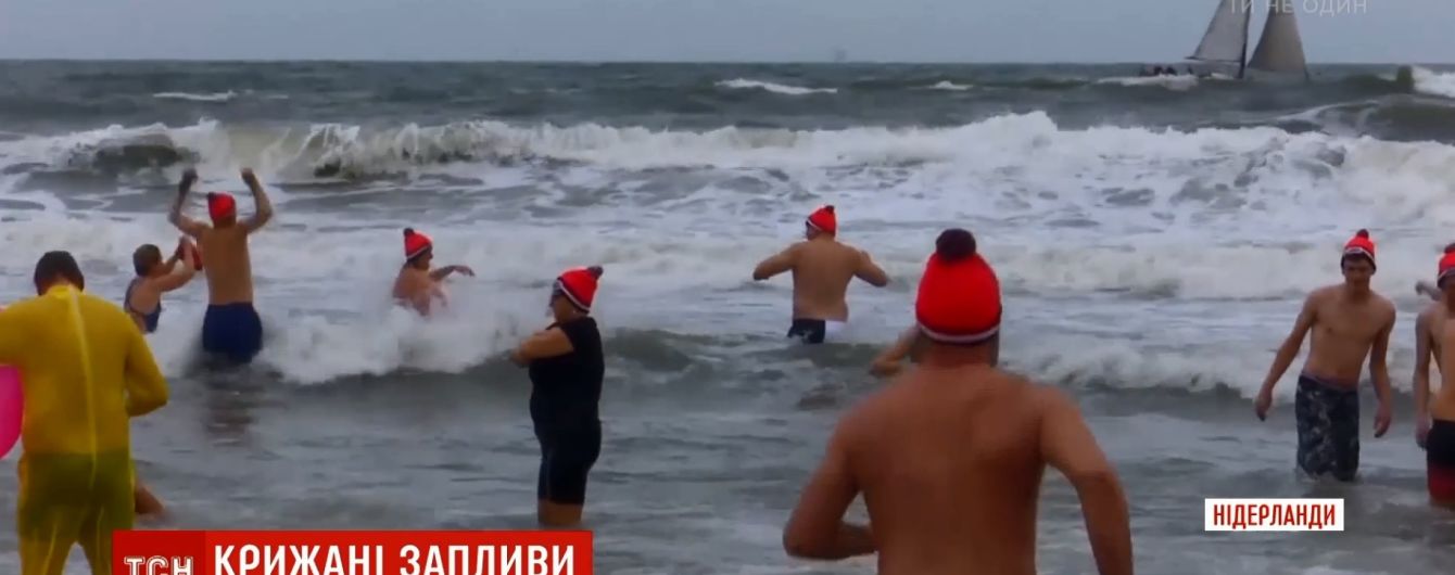 Ныряние в ледяную воду и прыжки с моста: европейцы удивили празднованием Нового года