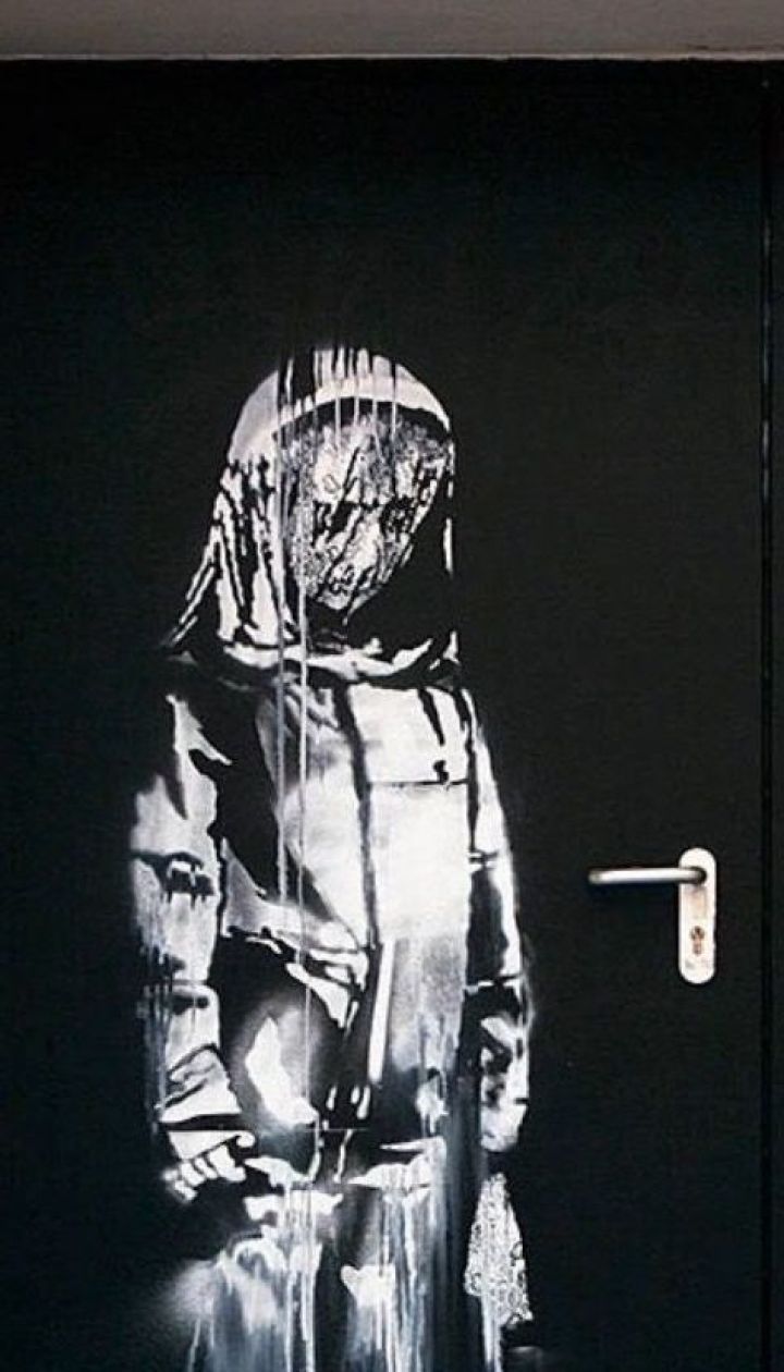   In Paris , graffiti of a popular artist, Banksy 