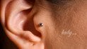 Чи може пірсинг у вухах допомогти проти мігрені