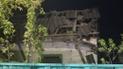 Люди прибирають уламки, прибирають вибите скло після ракетного удару