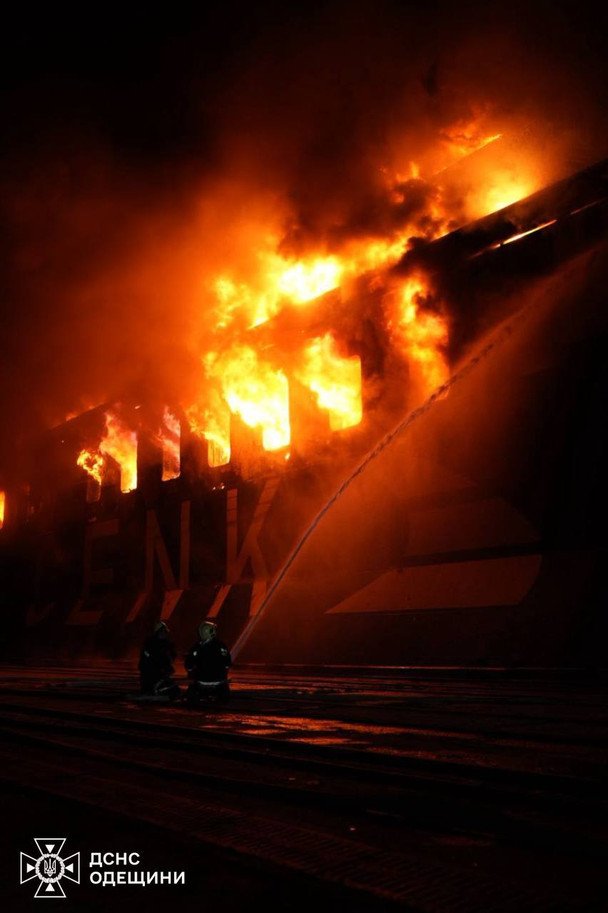 Rescuers are extinguishing the fire on the civilian vessel