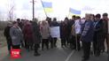 Селяни після кількох місяців невиплат зарплати перекрили державну трасу