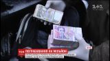 В Харькове посреди улицы неизвестные отобрали у мужчины сумку с миллионом гривен