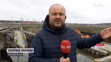 Будівельники закінчують спорудження тимчасового моста через річку Ірпінь