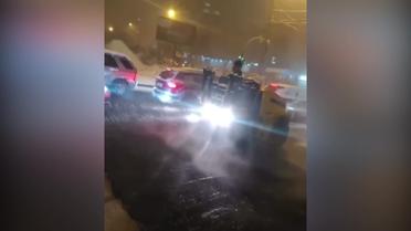 У Києві укладали асфальт під час снігопаду