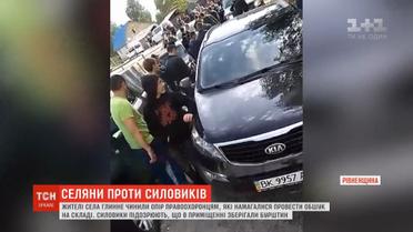 Селяни влаштували штовханину з правоохоронцями, аби ті не проводили обшук на складі депутата райради