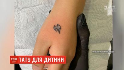 Отец без разрешения матери набил на руке 7-летнего сына тату