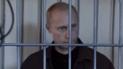 Путин за решеткой. Скриншот с видео.