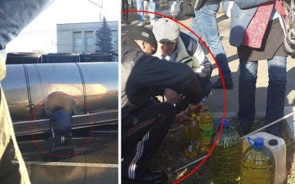 Киевляне бросились собирать "халявное" масло после аварии цистерны на проспекте Победы