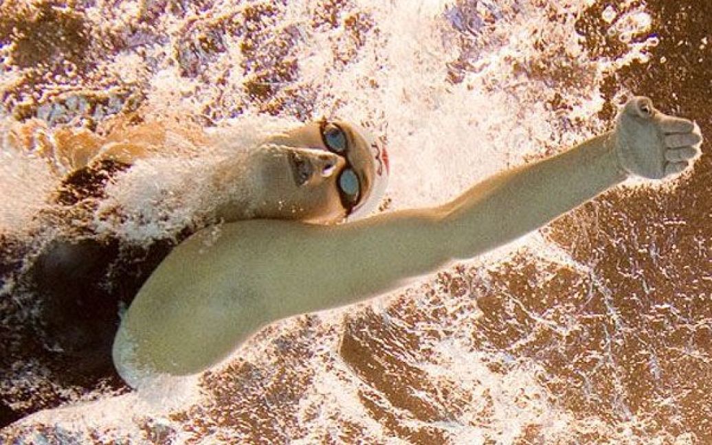 Китай, Шанхай. Датська спортсменка Лотте Фріїс виступає у фінальному запливі на 1500 метрів вільним стилем серед жінок на чемпіонаті світу FINA. Лотте виграла золото. / © AFP