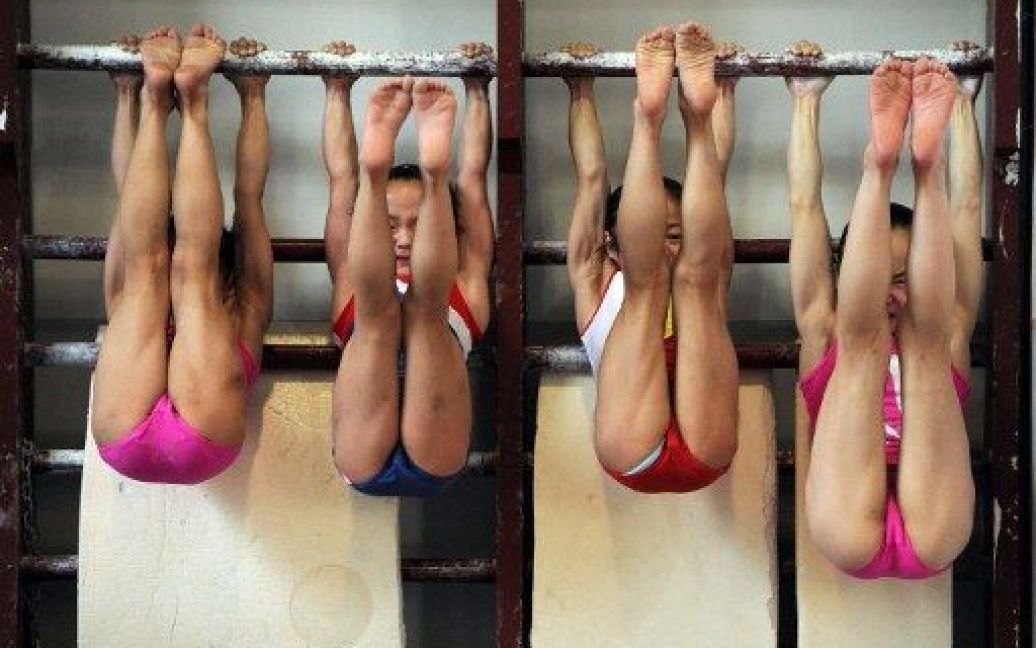 Тренування гімнасток у спортшколі / © AFP