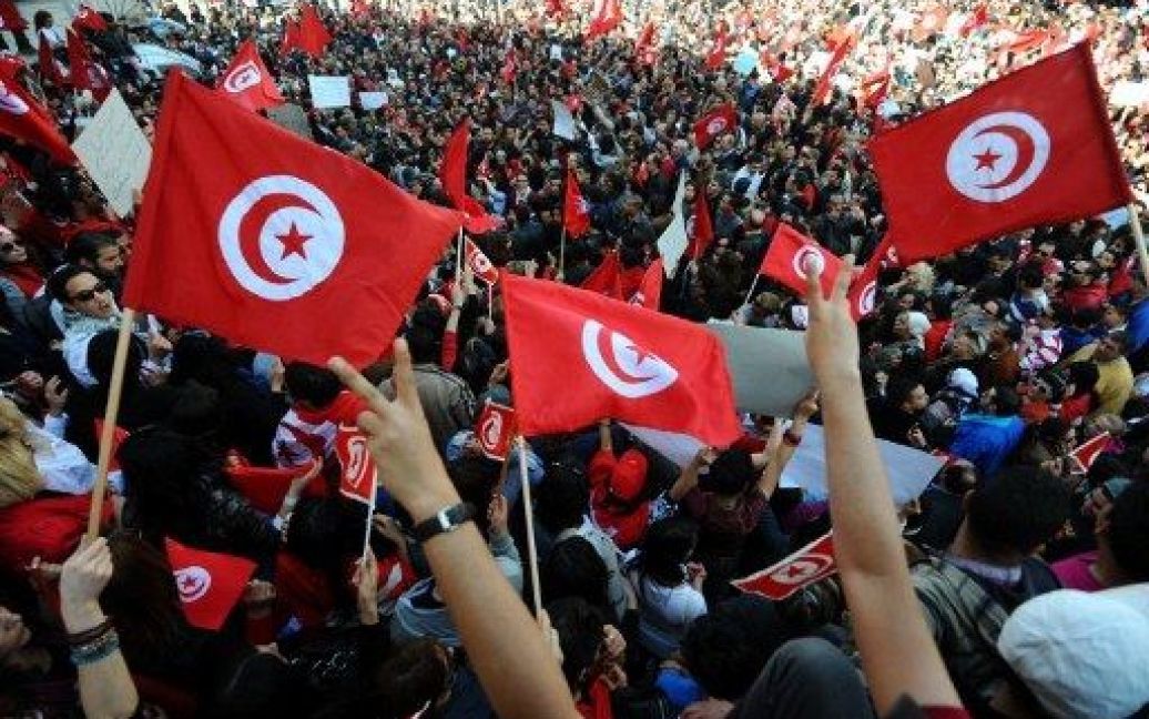 Туніс, Туніс. Сотні людей взяли участь у демонстрації з нагоди святкування Дня незалежності своєї країни. / © AFP