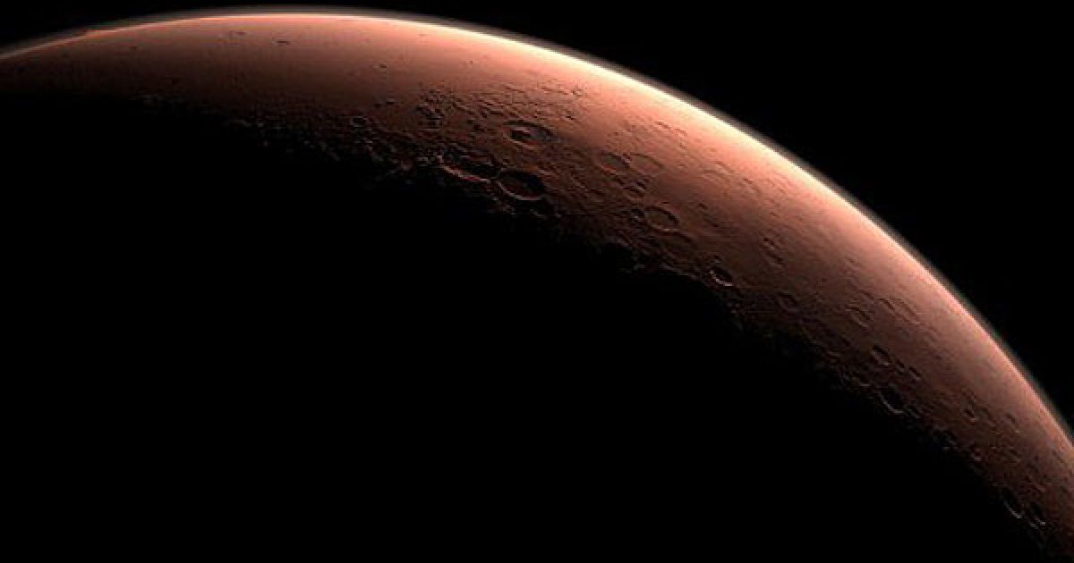 Космос. Частина Марса на кордоні між темрявою і світлом, включаючи кратер Гейла, у ранковому світлі. НАСА обрало кратер Гейла в якості посадкового майданчика для наукової дослідницької лабораторії "Mars Science Laboratory". Марсоход доставлять на Марс у серпні 2012 року. Фото AFP/NASA/JLP/Caltech / © AFP