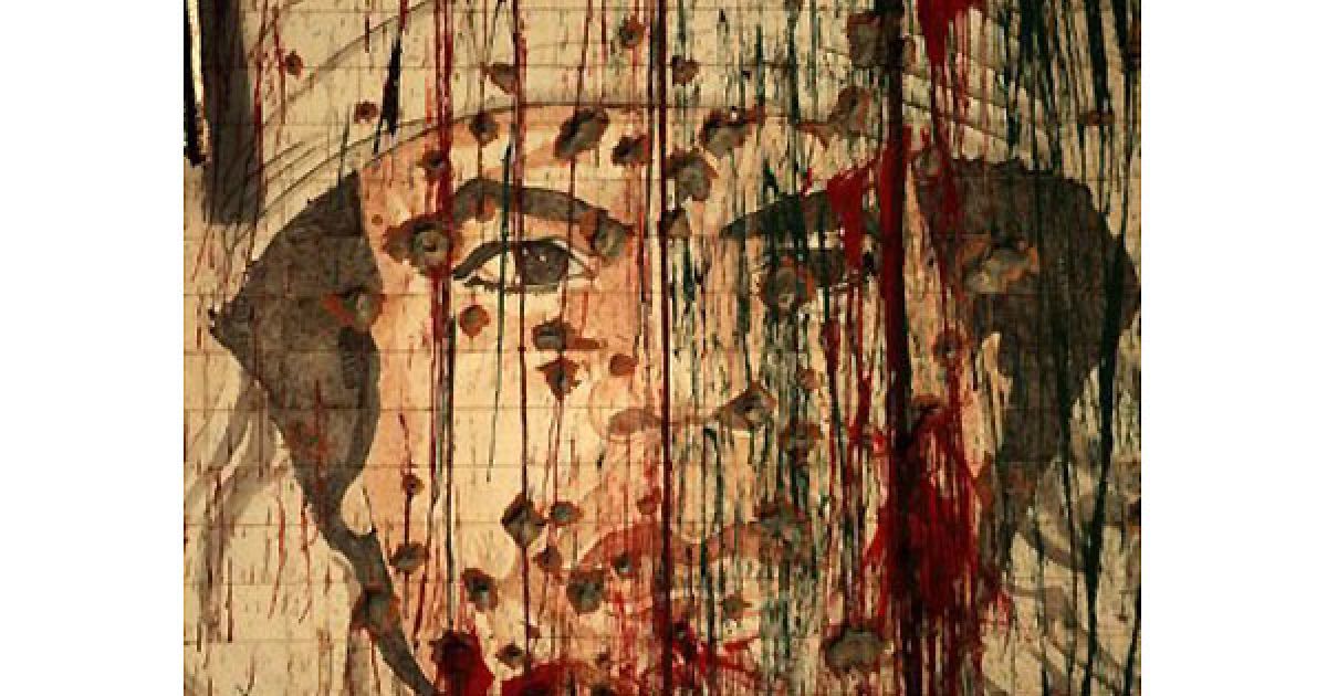 Лівійська Арабська Джамахірія, Тріполі. Пошкоджений портрет лівійського лідера-втікача Муаммара Каддафі зображений на стіні у Тріполі. Каддафі пообіцяв своїм прихильникам не здаватися та відзначив 42-гу річницю перевороту, який привів його до влади. / © AFP