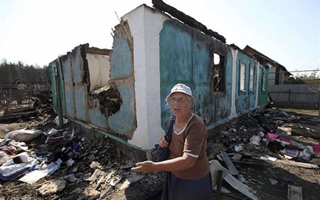 У селищі Маслівка, що знаходиться в межах міста, повністю згоріли 104 будинки. / © AFP
