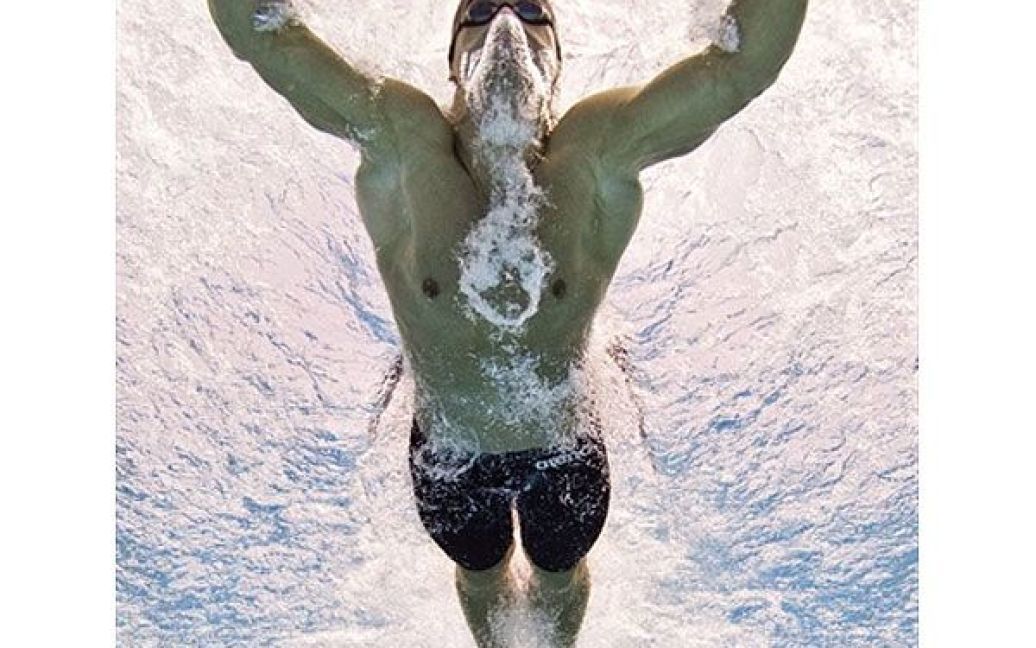 Угорщина, Будапешт. Російський спортсмен Євген Коротишкін пливе під водою під час кваліфікаційного запливу на 50 метрів стилем батерфляй серед чоловіків. У Будапешті проходить чемпіонат Європи з водних видів спорту. / © AFP