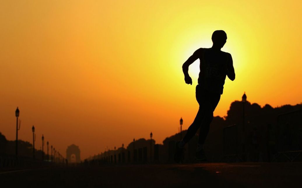 Бігун під час марафону на 11-ий день Ігор Співдружності у Нью-Делі. (Mark Dadswell / Getty Images) / © The Boston Globe