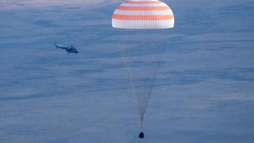 Команда складалася з російського космонавта Анатолія Іванишина, астронавта зі США Кейт Рубінс та їхнього японського колеги Такуї Оніші. / © Reuters