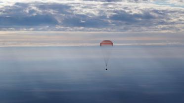 Команда складалася з російського космонавта Анатолія Іванишина, астронавта зі США Кейт Рубінс та їхнього японського колеги Такуї Оніші. / © Reuters