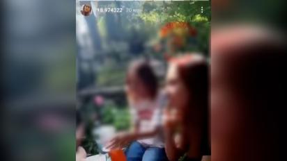 В Киеве девушки устроили пирушку на кладбище: они выпивали и пели