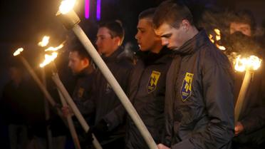 Активисты "Азова" с факелами вспоминают жертв теракта под посольством Бельгии в Киеве. / © Reuters