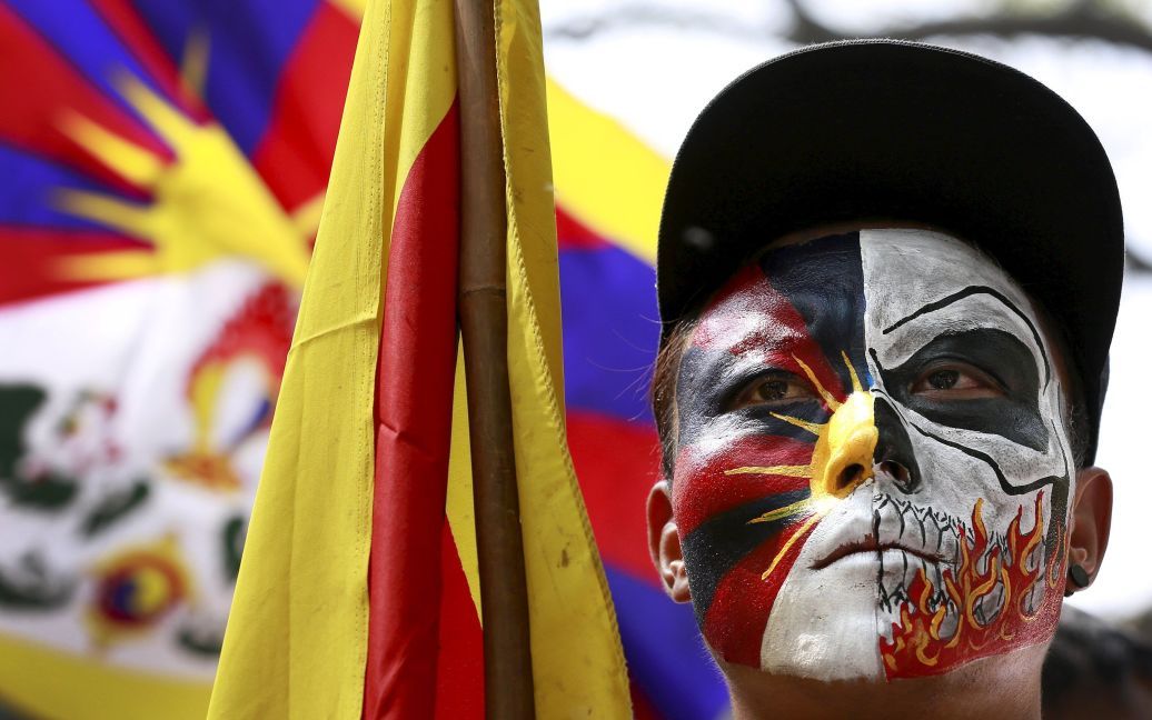 Тибетский активист посещает акцию протеста по случаю 57-й годовщины тибетского восстания против китайского правления, в Нью-Дели, Индия. / © Reuters
