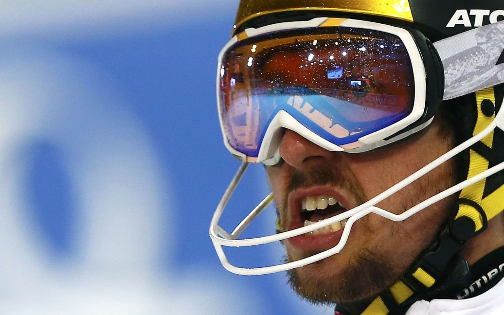 Спортсмен из Австрии показывает свои эмоции после участия в мужском слаломе на Кубке мира по горным лыжам в Шладминге, Австрия. / © Reuters