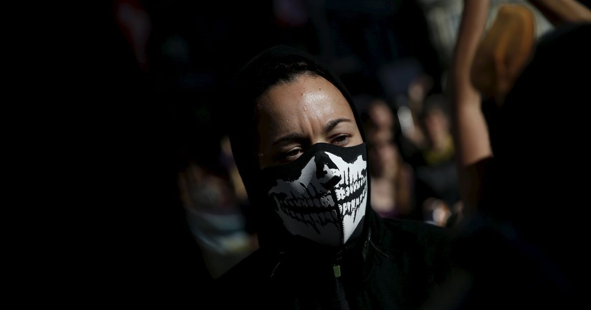 Жінка бере участь у марші проти гендерного насильства в центрі Мадрида, Іспанія, 7 листопада тисячі людей з усієї Іспанії взяли участь в маршах протесту проти насильства. / © Reuters