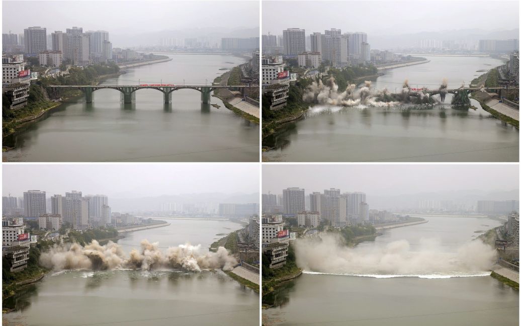 В китайском городе Чжанцзяцзе подрывают старый мост через реку. Вместо него построят новый / © Reuters