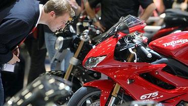 Найбільша у світі мотовиставка Intermot, яка проходить у Кельні (Німеччина), цього року зібрала більше тисячі фірм з 40 країн, які представляють мотоцикли, квадроцикли, трайки, скутери тощо. / © AFP